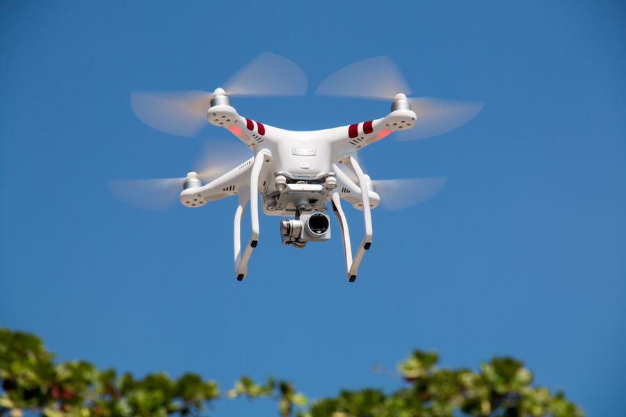 Gimbal-stabilised camera drone in flight