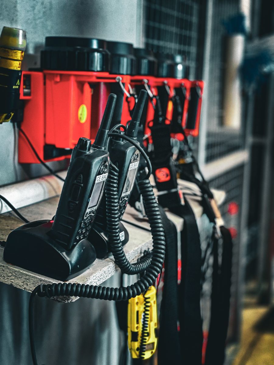 Radio test gear and handheld sets in a charging rack