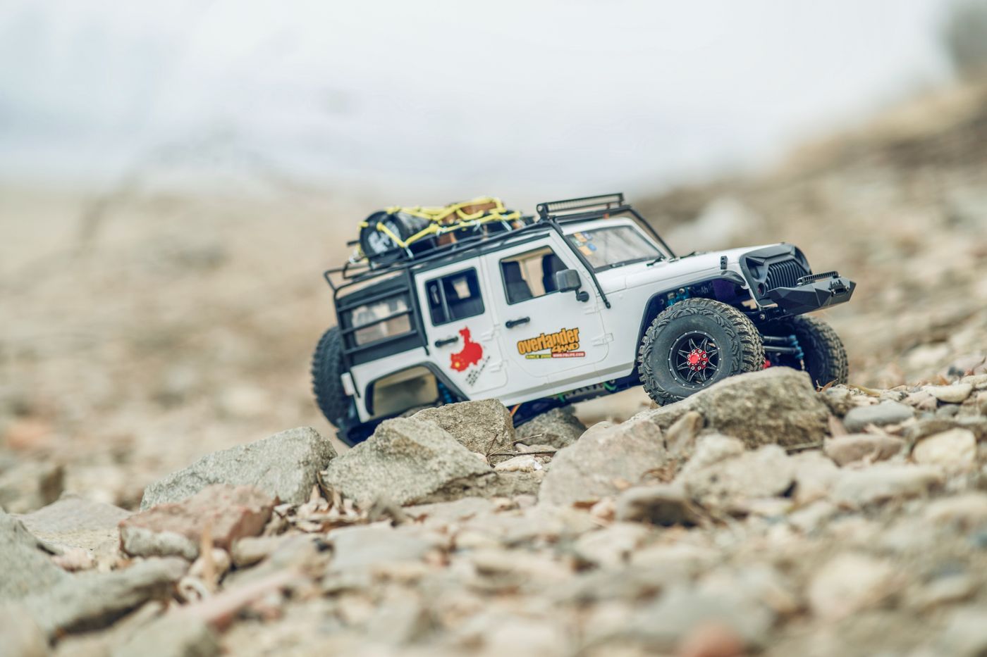 Scale radio controlled trail truck on rocky ground
